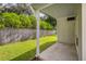 Private backyard with covered patio and wooden fence at 36731 Tara Ave, Zephyrhills, FL 33542