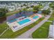 Aerial view of community pool area with multiple pools and lounge chairs at 36731 Tara Ave, Zephyrhills, FL 33542