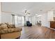 Bright living room featuring hardwood floors and ample natural light at 36731 Tara Ave, Zephyrhills, FL 33542