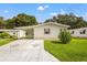 Single story home with carport and landscaped yard at 36731 Tara Ave, Zephyrhills, FL 33542