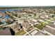 Aerial view of a neighborhood with lake, showing property location at 7720 Rathdown Ln, Wesley Chapel, FL 33545