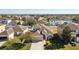 Two-story house situated in a residential neighborhood with a large yard at 7720 Rathdown Ln, Wesley Chapel, FL 33545