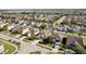 Aerial view of a residential neighborhood showcasing the property's surroundings at 7720 Rathdown Ln, Wesley Chapel, FL 33545