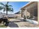 Backyard patio with screened porch and grill at 7720 Rathdown Ln, Wesley Chapel, FL 33545