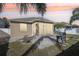 Screened patio, grill, firepit, and brick pavers at 7720 Rathdown Ln, Wesley Chapel, FL 33545