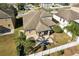 House with screened-in patio, fenced backyard and grill at 7720 Rathdown Ln, Wesley Chapel, FL 33545