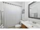 Clean bathroom with shower/tub combo, vanity, and linen closet at 7720 Rathdown Ln, Wesley Chapel, FL 33545