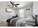Spacious bedroom with a double bed and wall-mounted TV at 7720 Rathdown Ln, Wesley Chapel, FL 33545