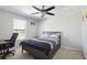 Bedroom with a double bed, desk, and ceiling fan at 7720 Rathdown Ln, Wesley Chapel, FL 33545