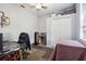 Bedroom with home office space, desk, and double door closet at 7720 Rathdown Ln, Wesley Chapel, FL 33545