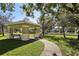 Relaxing gazebo with benches, shaded seating at 7720 Rathdown Ln, Wesley Chapel, FL 33545