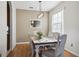 Light and airy dining room with a farmhouse table at 7720 Rathdown Ln, Wesley Chapel, FL 33545
