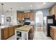 Updated kitchen with stainless steel appliances and island at 7720 Rathdown Ln, Wesley Chapel, FL 33545