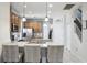 Modern kitchen with stainless steel appliances and an island with seating at 7720 Rathdown Ln, Wesley Chapel, FL 33545