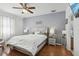 Large main bedroom with ceiling fan and en-suite bathroom at 7720 Rathdown Ln, Wesley Chapel, FL 33545