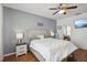 Main bedroom with a king-size bed and plenty of natural light at 7720 Rathdown Ln, Wesley Chapel, FL 33545