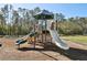 Play area with slides and play structures at 7720 Rathdown Ln, Wesley Chapel, FL 33545