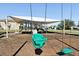 Play area with swings and shaded area at 7720 Rathdown Ln, Wesley Chapel, FL 33545