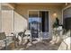 Outdoor patio area with seating and access to backyard at 7720 Rathdown Ln, Wesley Chapel, FL 33545