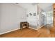 Small home office with wood desk and view into entryway at 6843 Runner Oak Dr, Wesley Chapel, FL 33545