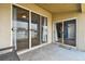 Covered patio with sliding glass doors at 6843 Runner Oak Dr, Wesley Chapel, FL 33545