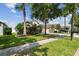 Single-Gathering home with landscaped yard and driveway at 6843 Runner Oak Dr, Wesley Chapel, FL 33545