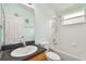 Clean bathroom with shower/tub combo and sink at 6843 Runner Oak Dr, Wesley Chapel, FL 33545