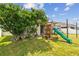 Backyard with playset and green space at 6843 Runner Oak Dr, Wesley Chapel, FL 33545
