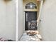 Elegant front door entry with arched window and sidelights at 6843 Runner Oak Dr, Wesley Chapel, FL 33545