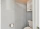 Small bathroom with toilet and storage cabinet at 6843 Runner Oak Dr, Wesley Chapel, FL 33545