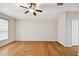 Bright living room featuring hardwood floors and a ceiling fan at 6843 Runner Oak Dr, Wesley Chapel, FL 33545