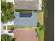 Aerial view showing house with solar panels and backyard at 6843 Runner Oak Dr, Wesley Chapel, FL 33545