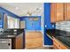 Open kitchen layout with breakfast bar and view of living room at 6843 Runner Oak Dr, Wesley Chapel, FL 33545