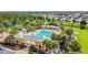 Community pool with a clubhouse and lush landscaping at 6843 Runner Oak Dr, Wesley Chapel, FL 33545