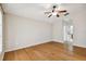 Well-lit bedroom with hardwood floors and ceiling fan at 6843 Runner Oak Dr, Wesley Chapel, FL 33545