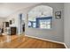 Open hallway with view into kitchen and living areas at 6843 Runner Oak Dr, Wesley Chapel, FL 33545