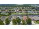 Aerial view of houses near a canal, showcasing community features at 6843 Runner Oak Dr, Wesley Chapel, FL 33545