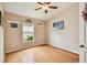 Bright bedroom with wood floors and ceiling fan at 6843 Runner Oak Dr, Wesley Chapel, FL 33545