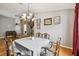 Dining room featuring a table set for six and hardwood floors at 6843 Runner Oak Dr, Wesley Chapel, FL 33545