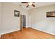 Bedroom with wood floors and ceiling fan at 6843 Runner Oak Dr, Wesley Chapel, FL 33545