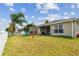 Spacious backyard with playset and grassy area at 6843 Runner Oak Dr, Wesley Chapel, FL 33545
