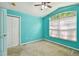 Teal bedroom with large window and closet at 6843 Runner Oak Dr, Wesley Chapel, FL 33545