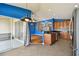 Open kitchen with a view of the backyard and access to the patio at 6843 Runner Oak Dr, Wesley Chapel, FL 33545