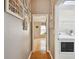 Hallway with laundry access and bedroom at 6843 Runner Oak Dr, Wesley Chapel, FL 33545