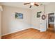 Bedroom with wood floors and ceiling fan at 6843 Runner Oak Dr, Wesley Chapel, FL 33545