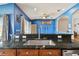 Kitchen island with granite countertop and stainless steel sink at 6843 Runner Oak Dr, Wesley Chapel, FL 33545