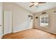 Bedroom with wood floors and ceiling fan at 6843 Runner Oak Dr, Wesley Chapel, FL 33545