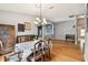 Bright dining room with wood floors and a chandelier at 6843 Runner Oak Dr, Wesley Chapel, FL 33545
