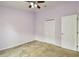 Empty bedroom with light purple walls and ceiling fan at 6843 Runner Oak Dr, Wesley Chapel, FL 33545