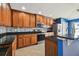 Kitchen with wood cabinets and granite countertops at 6843 Runner Oak Dr, Wesley Chapel, FL 33545
